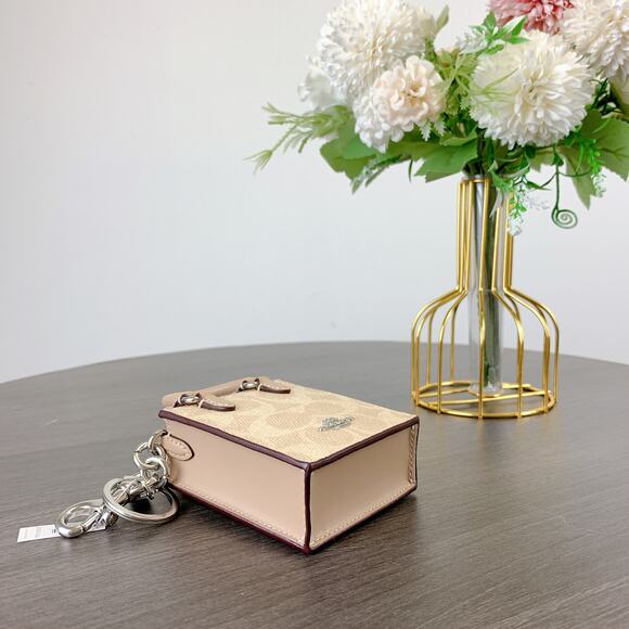 Coach CX069 North/South Mini Tote Bag Charm In Signature Canvas IN Sand Taupe - Picture 4 of 6